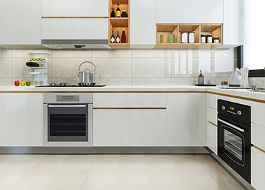 L-shaped white modular kitchen with clean aesthetics