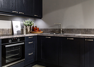 Glamorous black L-shaped modular kitchen