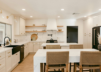 Sophisticated L-shaped cream modular kitchen with dark accents