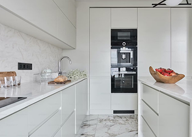 Modern White Kitchen with Marble Countertops and Backsplash 