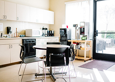 Cream coloured modular kitchen with overhead storage