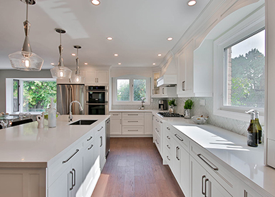 White Delight With Sleek Island Kitchen